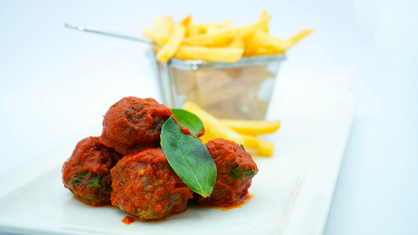 Meatballs with tomato sauce and fried potatoes